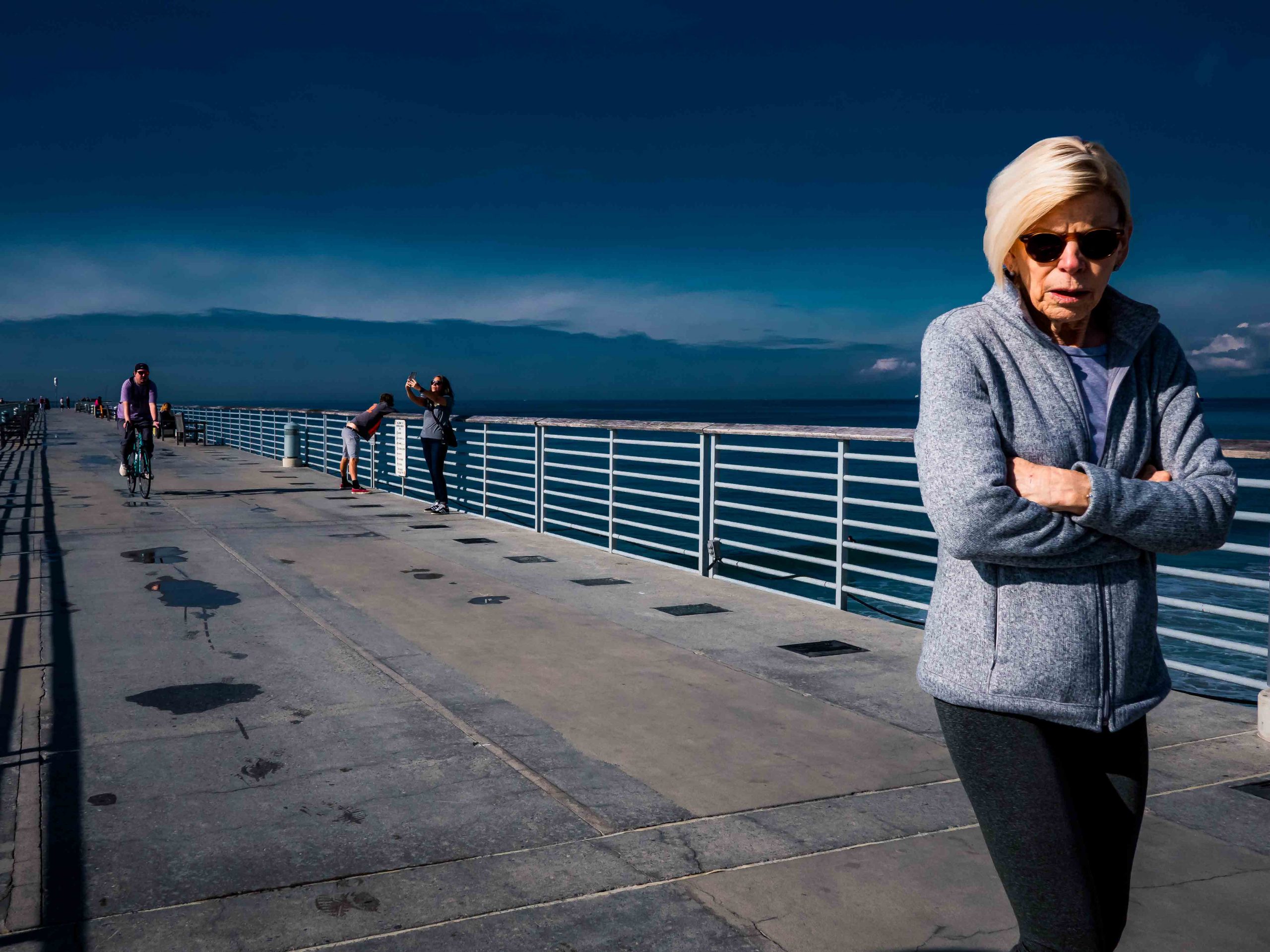 Lady on a pier in Manhattan Beach, California
